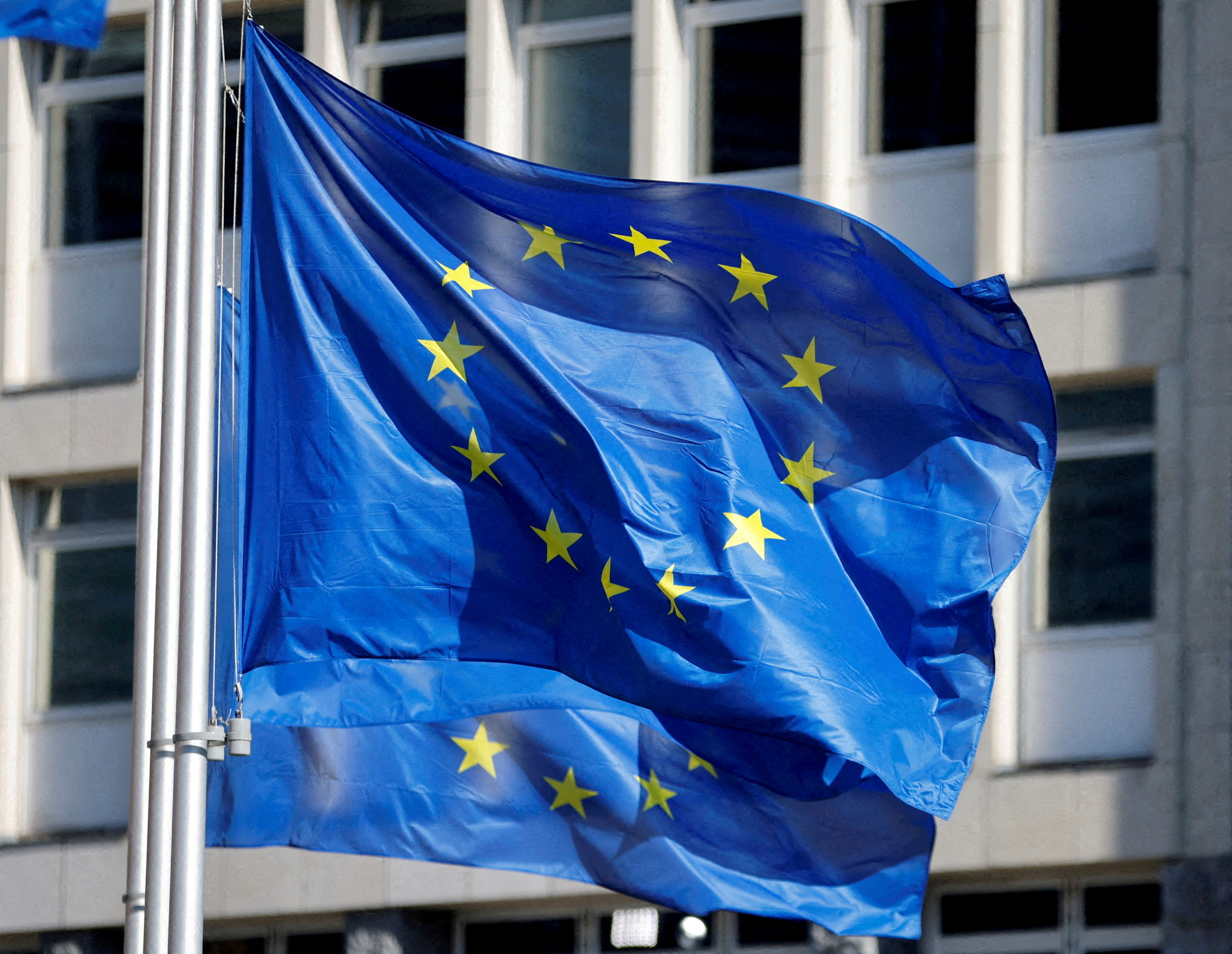 EuropeanÂ UnionÂ flags fly outside theÂ EuropeanÂ Commission headquarters in Brussels